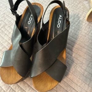 Also black high sandals.